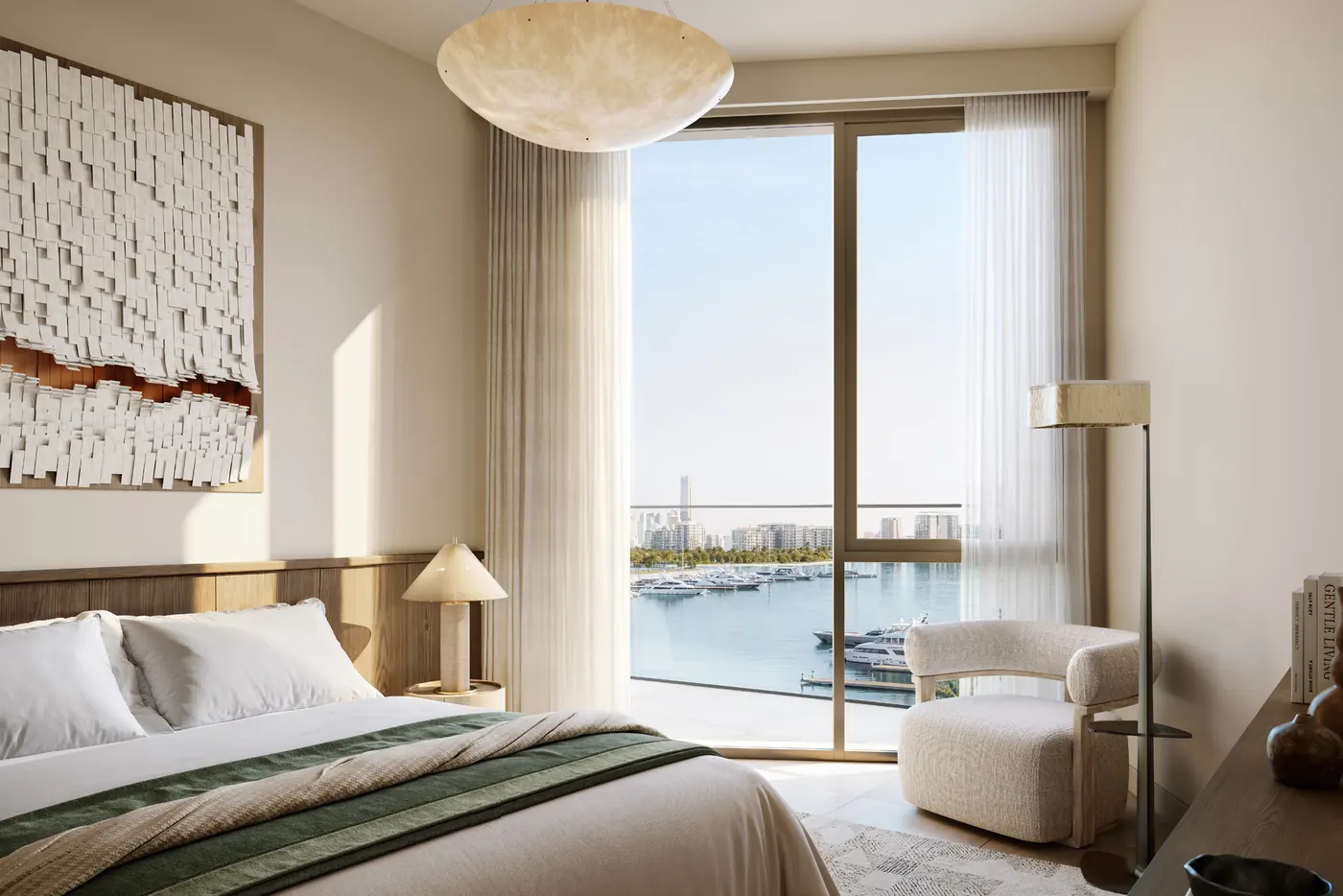 A bedroom opening onto a balcony with marina views