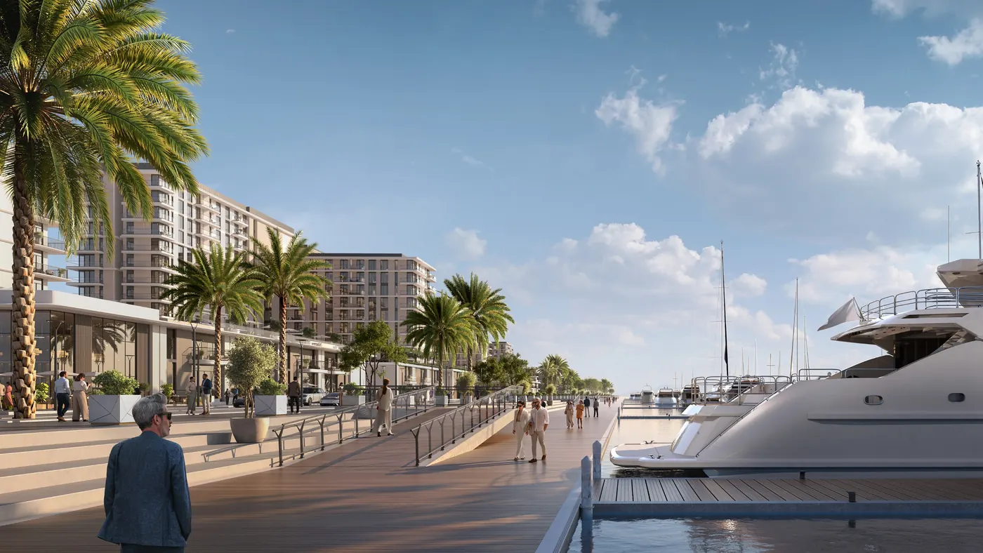 The palm-lined Marina Promenade with yachts moored alongside